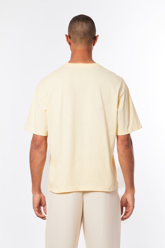pastel yellow t-shirt, butter yellow tee for men, summer t-shirt for men, t-shirt homme jaune clair, fashion-conscious men’s style, Paris summer fashion, affordable luxury streetwear, inspired by Zara, inspired by Jacquemus, summer vibes, riviera vibes, paris summer vibes, Forburi Paris, Forburi, Forburimen, menswear, menswearcasual