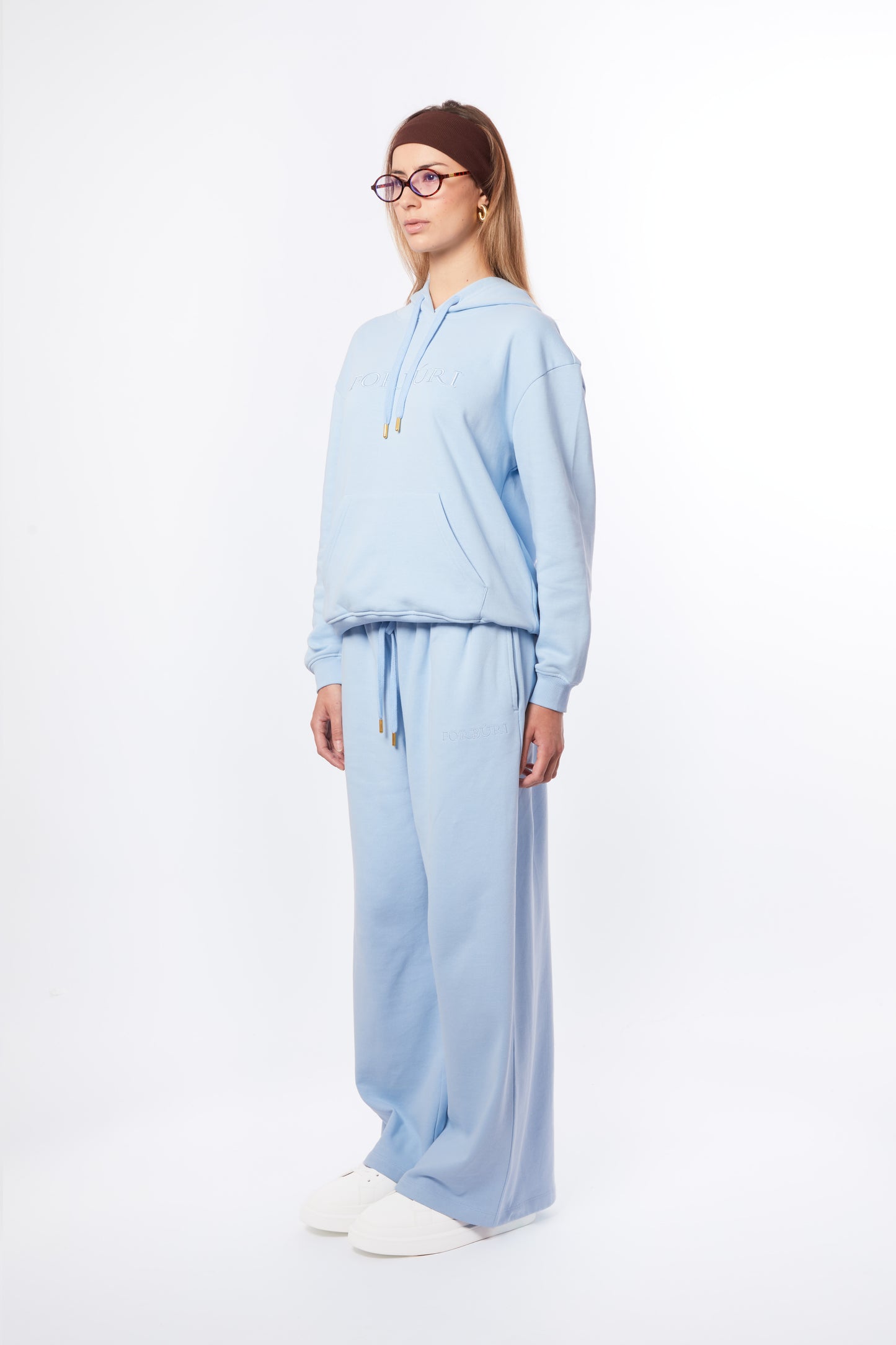 Forburi blue co-ord set for women – lagoon blue hoodie and pants set, soft and breathable, made for summer movement and minimalist style. Keywords: blue co-ord women, coordonné bleu femme, ensemble été femme, hoodie set femme pastel, tenue décontractée chic, summer vibes, riviera vibes, paris summer vibes, Forburi Paris, Forburi, womenswear, womenswearcasual
