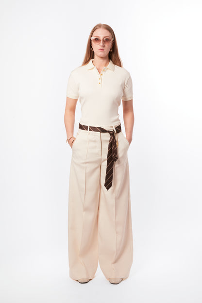 Forburi ecru polo shirt for women – neutral beige cotton polo with subtle logo, relaxed fit, and French minimalist energy. Keywords: ecru polo women, polo femme beige, chemise polo coton femme, neutral summer polo, casual chic polo femme, basic élégant été, summer vibes, riviera vibes, paris summer vibes, Forburi Paris, Forburi, womenswear, womenswearcasual
