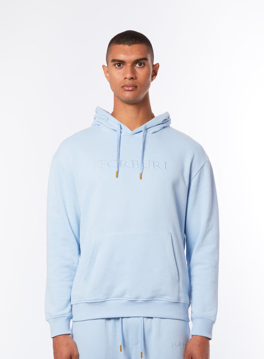 blue hoodie men, lagoon blue hoodie, pastel blue casualwear, minimalist hoodie for men, premium streetwear, Forburi Paris hoodie, menswear casual, summer vibes, riviera vibes, paris summer vibes, Forburi, Forburimen, menswearcasual, Forburi lagoon blue men’s hoodie – pastel blue premium cotton hoodie with minimalist design, ideal for summer streetwear with Parisian and Riviera vibes (hoodie homme bleu lagon, style casual, mode urbaine).