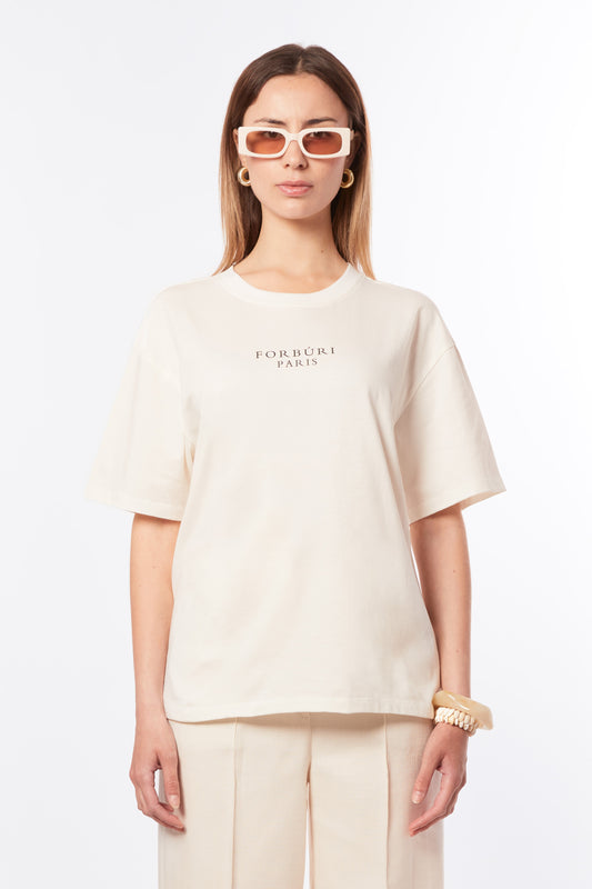 Forburi ecru T-shirt for women – minimalist beige cotton tee with subtle logo, designed for effortless French chic. Keywords: ecru t-shirt women, t-shirt femme beige, neutral summer tee, cotton t-shirt femme, chic parisien, summer vibes, riviera vibes, paris summer vibes, Forburi Paris, Forburi, womenswear, womenswearcasual
