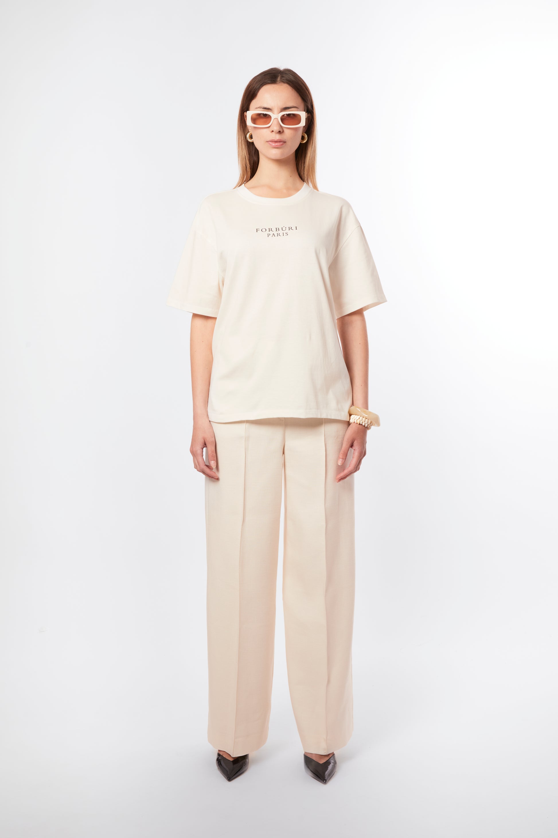 Forburi ecru T-shirt for women – minimalist beige cotton tee with subtle logo, designed for effortless French chic. Keywords: ecru t-shirt women, t-shirt femme beige, neutral summer tee, cotton t-shirt femme, chic parisien, summer vibes, riviera vibes, paris summer vibes, Forburi Paris, Forburi, womenswear, womenswearcasual
