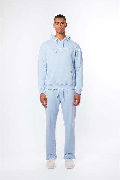 Forburi powder blue men’s co-ord set – pastel hoodie and pants crafted in soft cotton. A summer essential for minimalist streetwear with French influence. Keywords: powder blue co-ord men, pastel blue hoodie pants set, coordonné bleu clair homme, ensemble d’été homme, summer loungewear, minimal streetwear, riviera vibes, paris summer vibes, Forburi Paris, Forburi, Forburimen, menswear, menswearcasual
