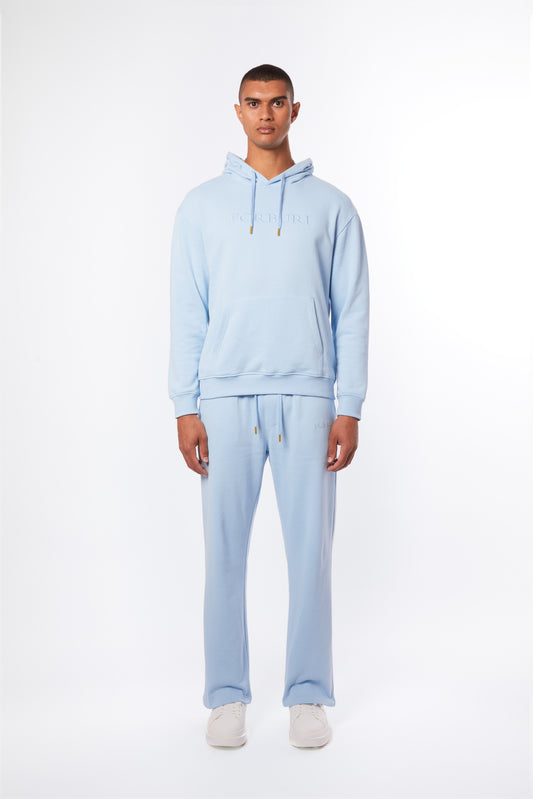 Forburi powder blue men’s co-ord set – pastel hoodie and pants crafted in soft cotton. A summer essential for minimalist streetwear with French influence. Keywords: powder blue co-ord men, pastel blue hoodie pants set, coordonné bleu clair homme, ensemble d’été homme, summer loungewear, minimal streetwear, riviera vibes, paris summer vibes, Forburi Paris, Forburi, Forburimen, menswear, menswearcasual
